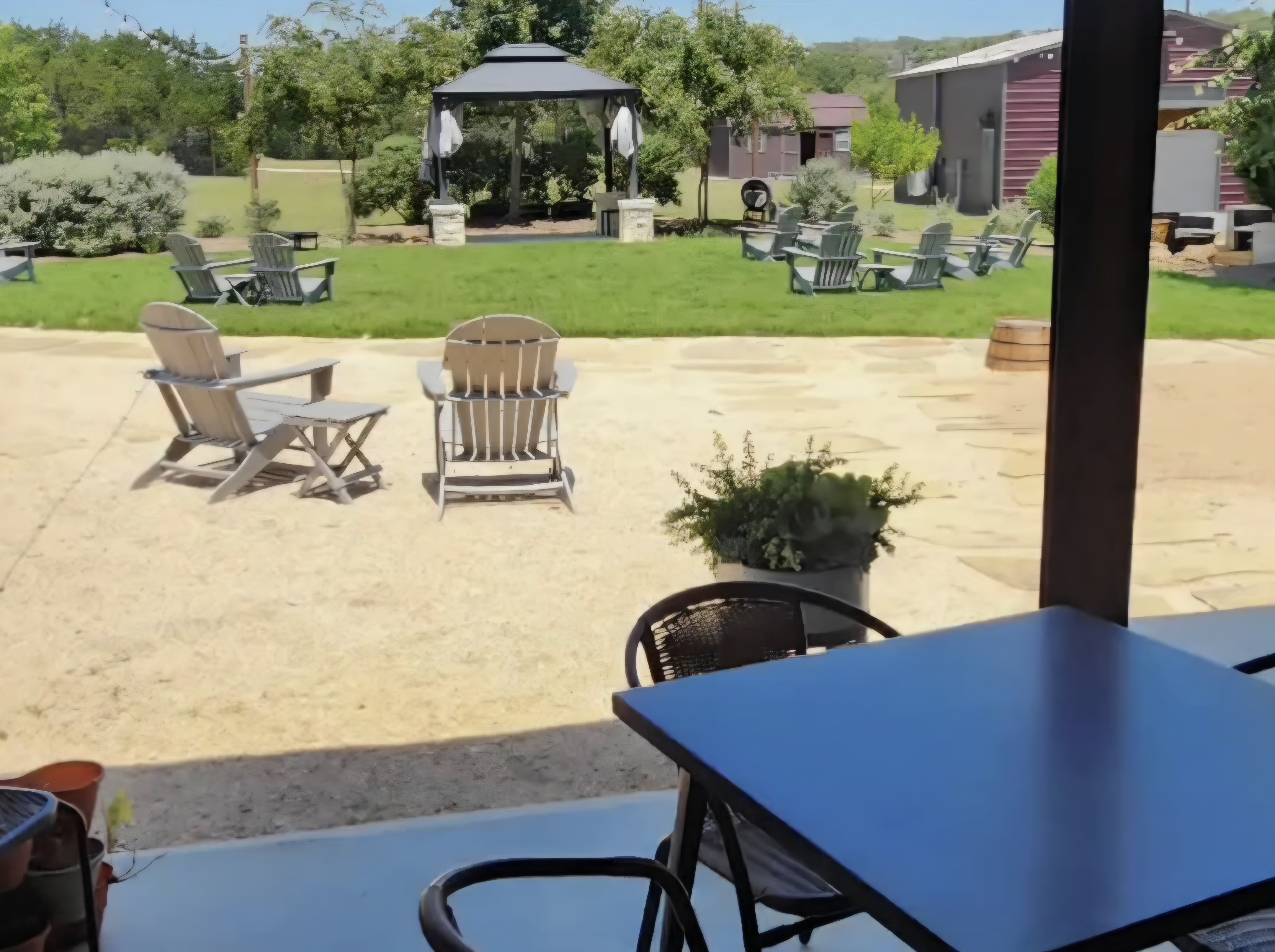 Kai-Simone Winery garden patio with Adirondack chairs, stone pavers, gazebo and Hill Country views
