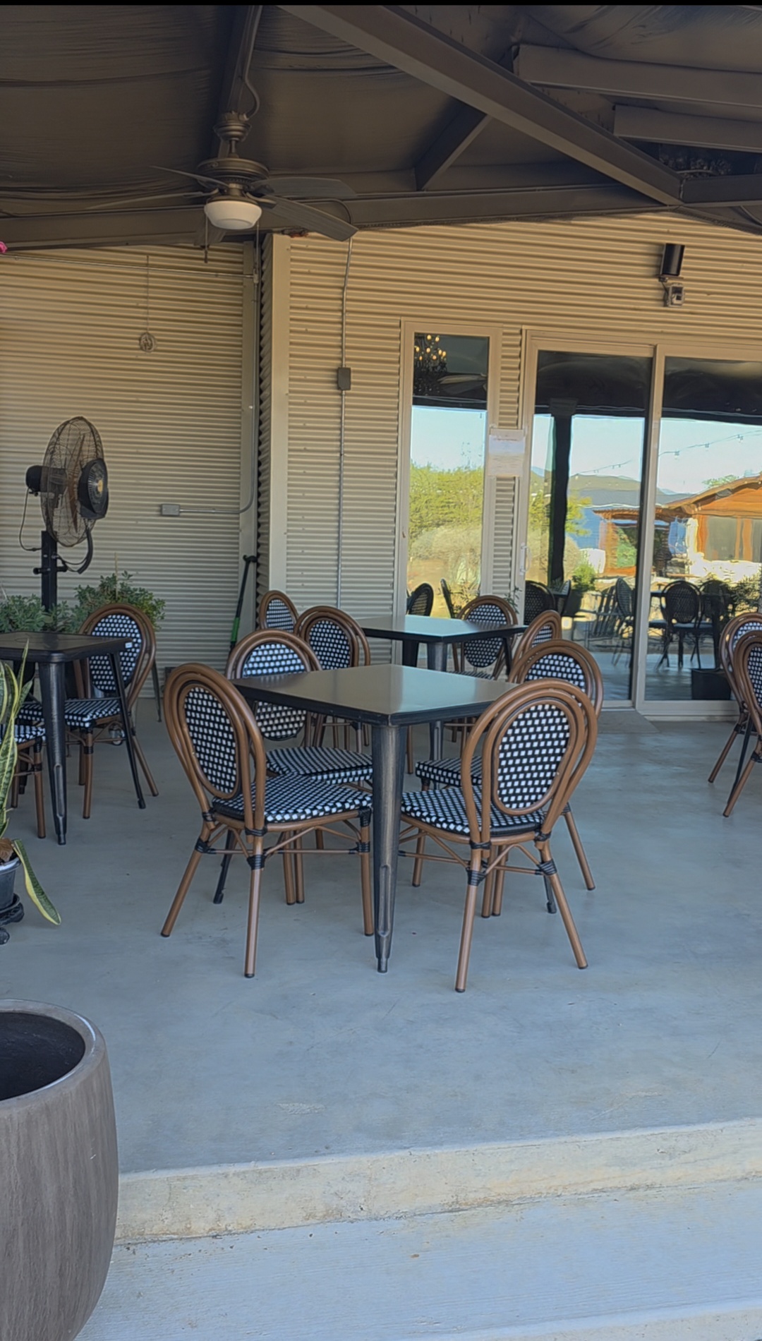 Kai-Simone Winery covered patio seating area with Hill Country views
